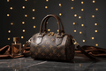 Monogram barrel bag koyu kahve stüdyo görseli